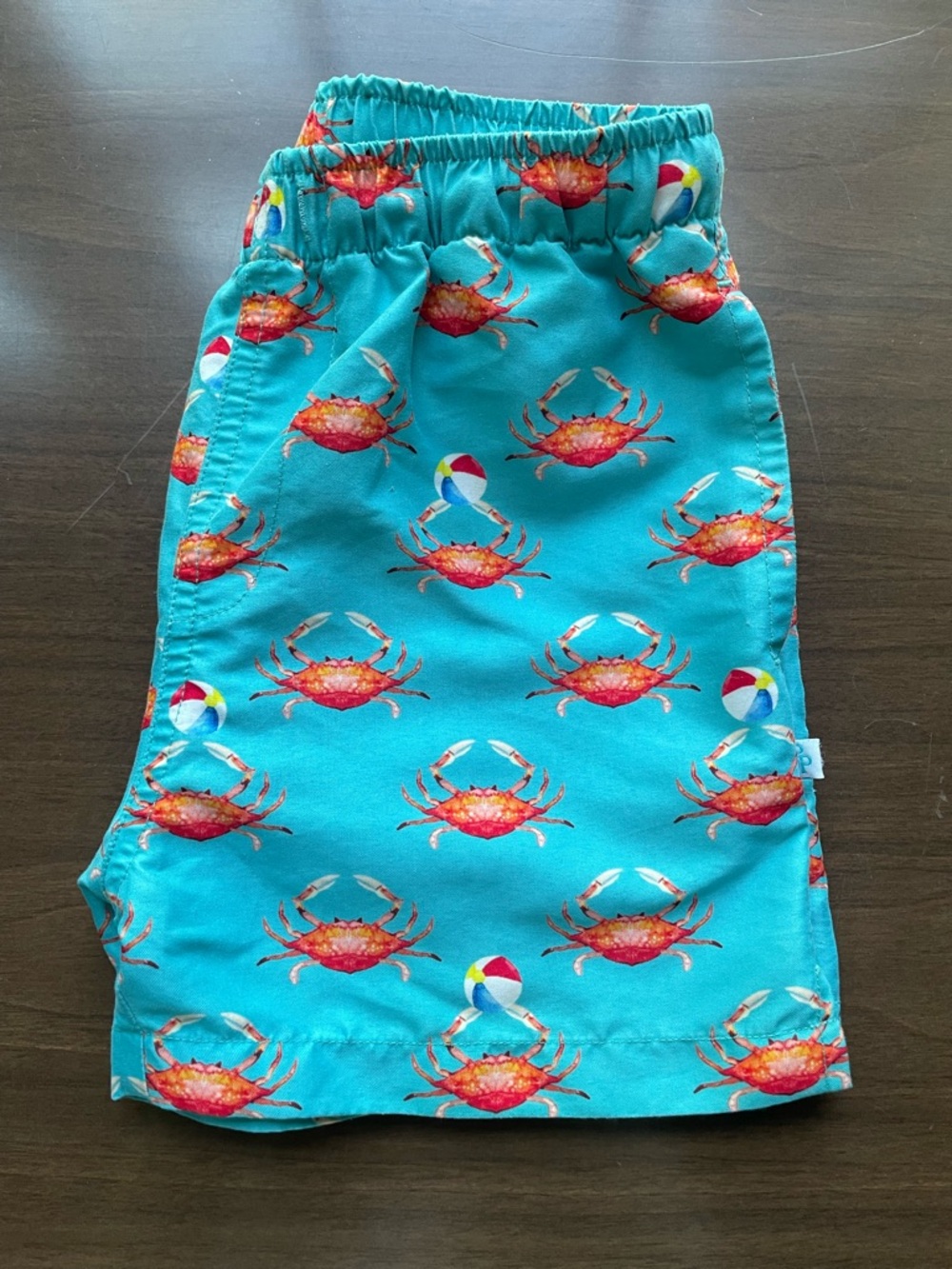 Posh Peanut Turquoise Crab Print swim trunks